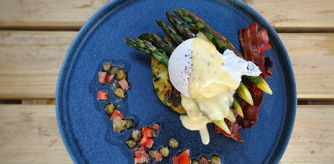 Bubble and Squeak Cakes with Poached Egg, Asparagus Spears and Hollandaise Sauce.
